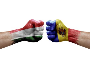 Two hands punch to each others on white background. Country flags painted fists, conflict crisis concept between hungary and moldova