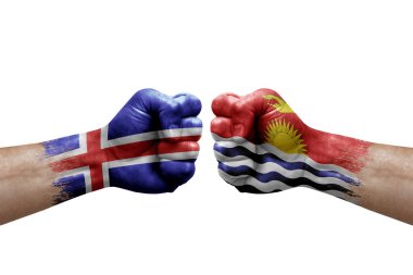 Two hands punch to each others on white background. Country flags painted fists, conflict crisis concept between iceland and kiribati