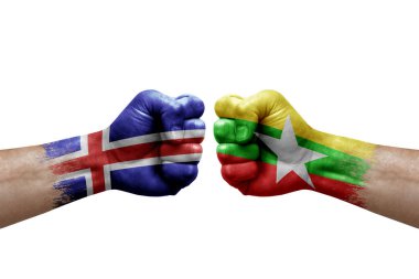 Two hands punch to each others on white background. Country flags painted fists, conflict crisis concept between iceland and myanmar