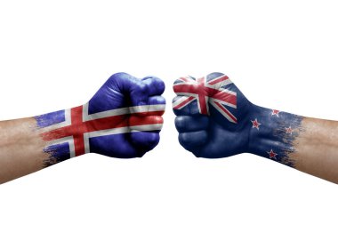 Two hands punch to each others on white background. Country flags painted fists, conflict crisis concept between iceland and new zealand