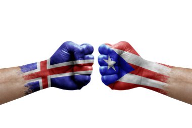 Two hands punch to each others on white background. Country flags painted fists, conflict crisis concept between iceland and puerto rico