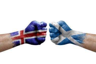 Two hands punch to each others on white background. Country flags painted fists, conflict crisis concept between iceland and scotland