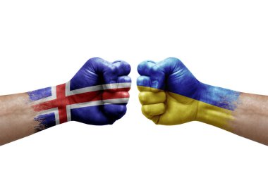 Two hands punch to each others on white background. Country flags painted fists, conflict crisis concept between iceland and ukraine