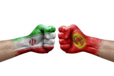 Two hands punch to each others on white background. Country flags painted fists, conflict crisis concept between iran and kyrgyzstan