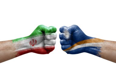 Two hands punch to each others on white background. Country flags painted fists, conflict crisis concept between iran and marshall islands