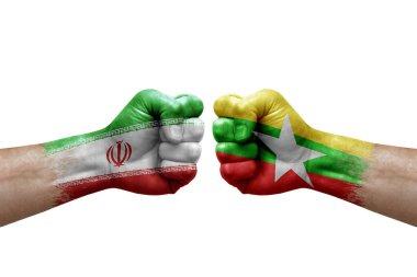 Two hands punch to each others on white background. Country flags painted fists, conflict crisis concept between iran and myanmar