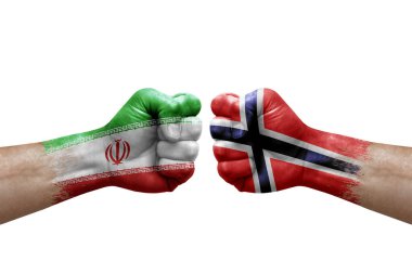 Two hands punch to each others on white background. Country flags painted fists, conflict crisis concept between iran and norway