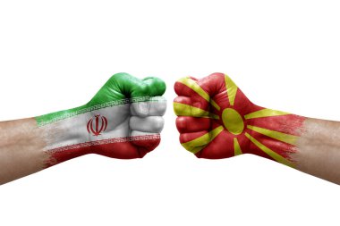 Two hands punch to each others on white background. Country flags painted fists, conflict crisis concept between iran and north macedonia