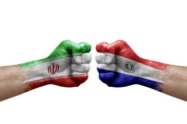 Two hands punch to each others on white background. Country flags painted fists, conflict crisis concept between iran and paraguay