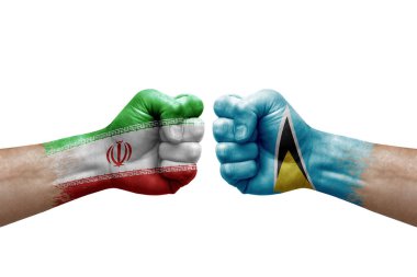 Two hands punch to each others on white background. Country flags painted fists, conflict crisis concept between iran and saint lucia