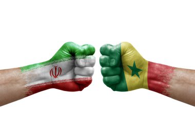 Two hands punch to each others on white background. Country flags painted fists, conflict crisis concept between iran and senegal