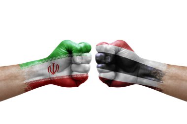 Two hands punch to each others on white background. Country flags painted fists, conflict crisis concept between iran and thailand
