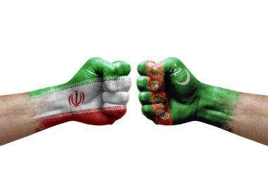 Two hands punch to each others on white background. Country flags painted fists, conflict crisis concept between iran and turkmenistan