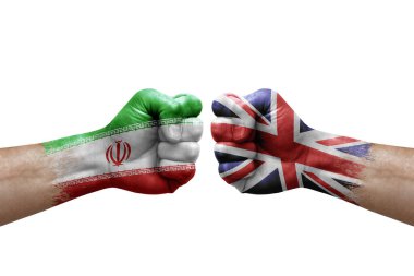 Two hands punch to each others on white background. Country flags painted fists, conflict crisis concept between iran and united kingdom
