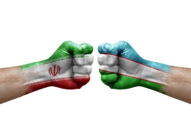 Two hands punch to each others on white background. Country flags painted fists, conflict crisis concept between iran and uzbekistan