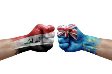 Two hands punch to each others on white background. Country flags painted fists, conflict crisis concept between iraq and tuvalu