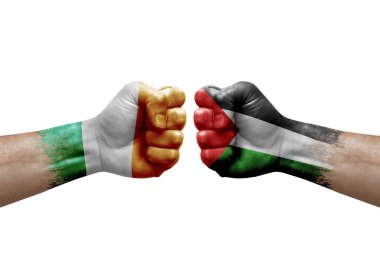 Two hands punch to each others on white background. Country flags painted fists, conflict crisis concept between ireland and palestine