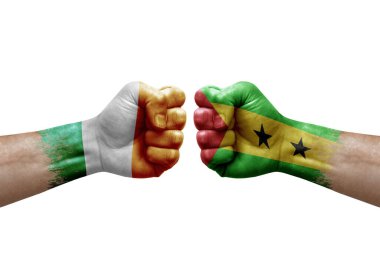 Two hands punch to each others on white background. Country flags painted fists, conflict crisis concept between ireland and sao tome and principe