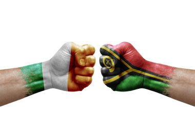 Two hands punch to each others on white background. Country flags painted fists, conflict crisis concept between ireland and vanuatu