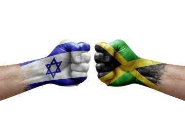 Two hands punch to each others on white background. Country flags painted fists, conflict crisis concept between israel and jamaica