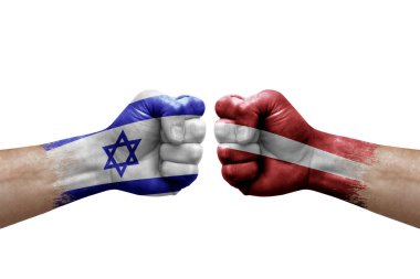 Two hands punch to each others on white background. Country flags painted fists, conflict crisis concept between israel and latvia