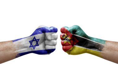 Two hands punch to each others on white background. Country flags painted fists, conflict crisis concept between israel and mozambique