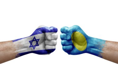 Two hands punch to each others on white background. Country flags painted fists, conflict crisis concept between israel and palau