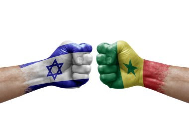 Two hands punch to each others on white background. Country flags painted fists, conflict crisis concept between israel and senegal