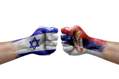 Two hands punch to each others on white background. Country flags painted fists, conflict crisis concept between israel and serbia