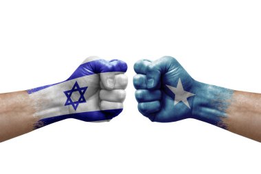 Two hands punch to each others on white background. Country flags painted fists, conflict crisis concept between israel and somalia