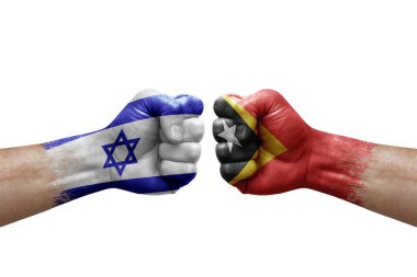 Two hands punch to each others on white background. Country flags painted fists, conflict crisis concept between israel and timor leste