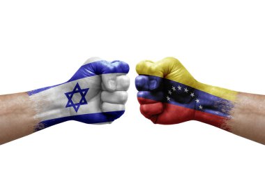 Two hands punch to each others on white background. Country flags painted fists, conflict crisis concept between israel and venezuela