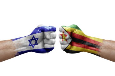 Two hands punch to each others on white background. Country flags painted fists, conflict crisis concept between israel and zimbabwe