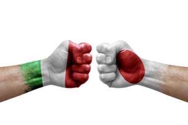 Two hands punch to each others on white background. Country flags painted fists, conflict crisis concept between italy and japan