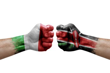 Two hands punch to each others on white background. Country flags painted fists, conflict crisis concept between italy and kenya