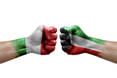 Two hands punch to each others on white background. Country flags painted fists, conflict crisis concept between italy and kuwait