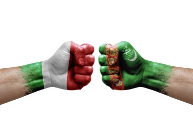 Two hands punch to each others on white background. Country flags painted fists, conflict crisis concept between italy and turkmenistan