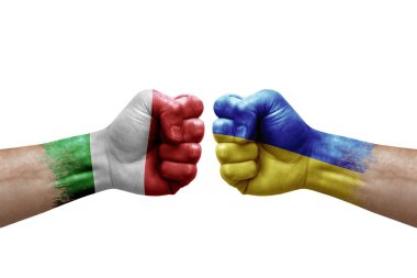 Two hands punch to each others on white background. Country flags painted fists, conflict crisis concept between italy and ukraine