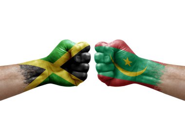 Two hands punch to each others on white background. Country flags painted fists, conflict crisis concept between jamaica and mauritania
