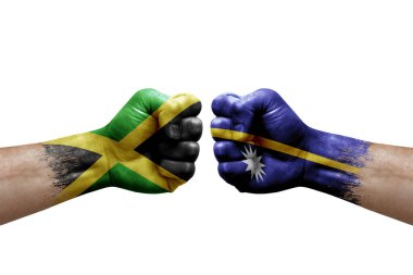 Two hands punch to each others on white background. Country flags painted fists, conflict crisis concept between jamaica and nauru