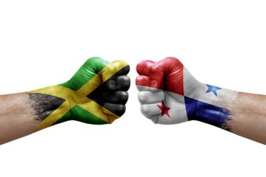 Two hands punch to each others on white background. Country flags painted fists, conflict crisis concept between jamaica and panama