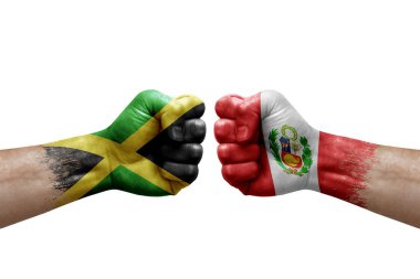 Two hands punch to each others on white background. Country flags painted fists, conflict crisis concept between jamaica and peru