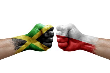 Two hands punch to each others on white background. Country flags painted fists, conflict crisis concept between jamaica and poland
