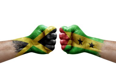 Two hands punch to each others on white background. Country flags painted fists, conflict crisis concept between jamaica and sao tome and principe