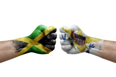 Two hands punch to each others on white background. Country flags painted fists, conflict crisis concept between jamaica and virgin islands