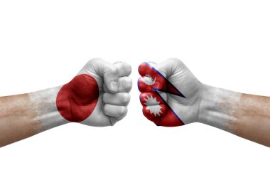Two hands punch to each others on white background. Country flags painted fists, conflict crisis concept between japan and nepal