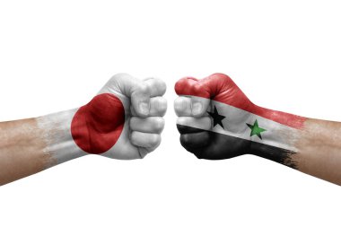 Two hands punch to each others on white background. Country flags painted fists, conflict crisis concept between japan and syria