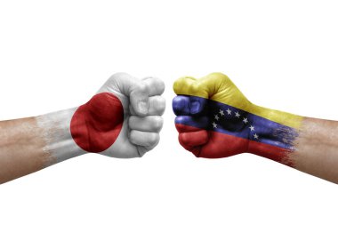 Two hands punch to each others on white background. Country flags painted fists, conflict crisis concept between japan and venezuela