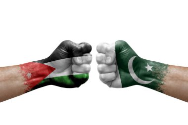 Two hands punch to each others on white background. Country flags painted fists, conflict crisis concept between jordan and pakistan