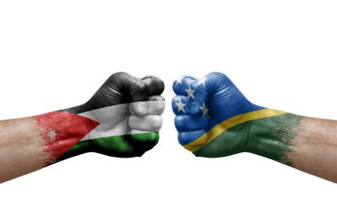 Two hands punch to each others on white background. Country flags painted fists, conflict crisis concept between jordan and solomon islands